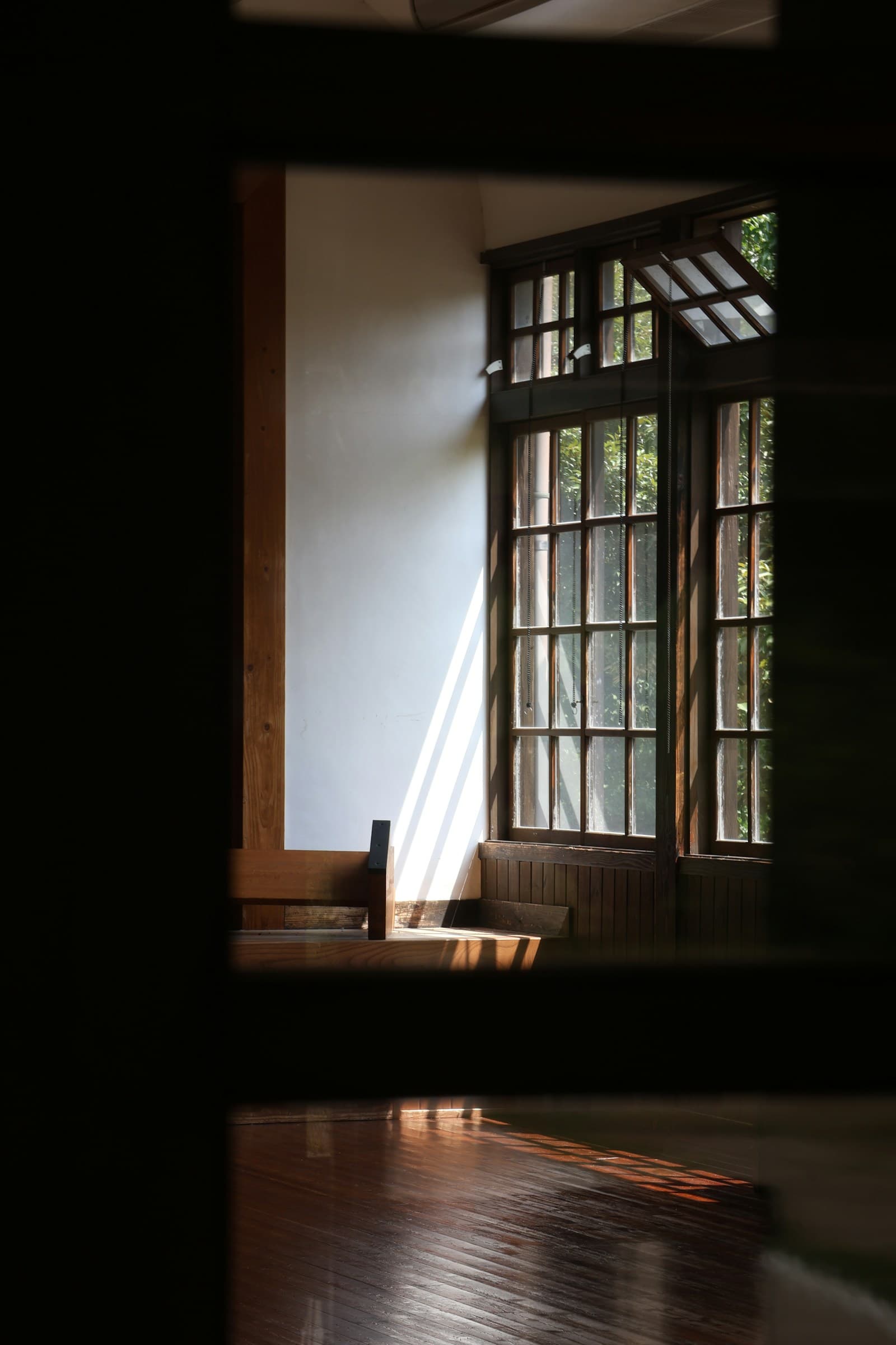 A timber-framed cottage bathed in golden hour light, showcasing hand-cut joinery and natural wood grain